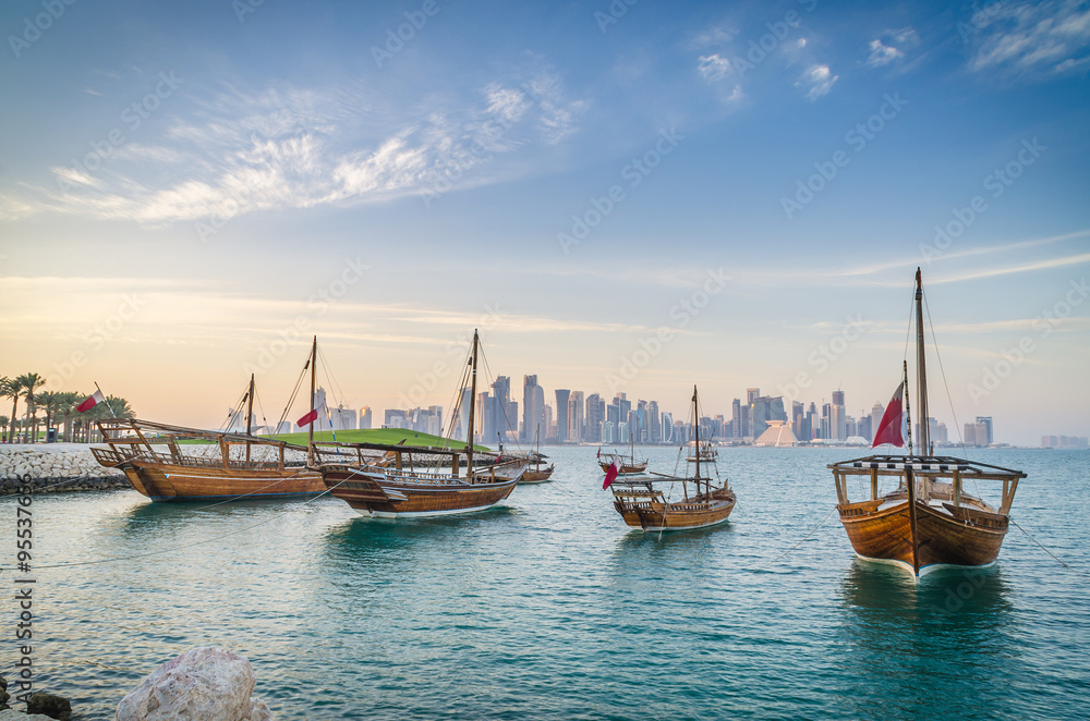 dhows moored off museum park in central doha qatar arabia with some of the buildings from the citys commercial port in the background stockpack adobe stock| وظائف مدرسة الدوحة البريطانية فِي قطر تعلن فرص عمل برواتب مميزة